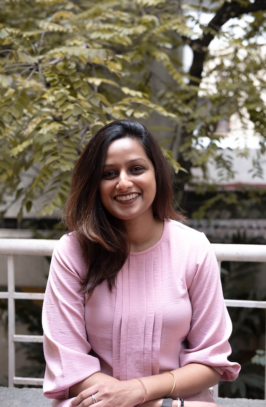Female strategist at her desk, representing masculine energy at work and corporate burnout culture