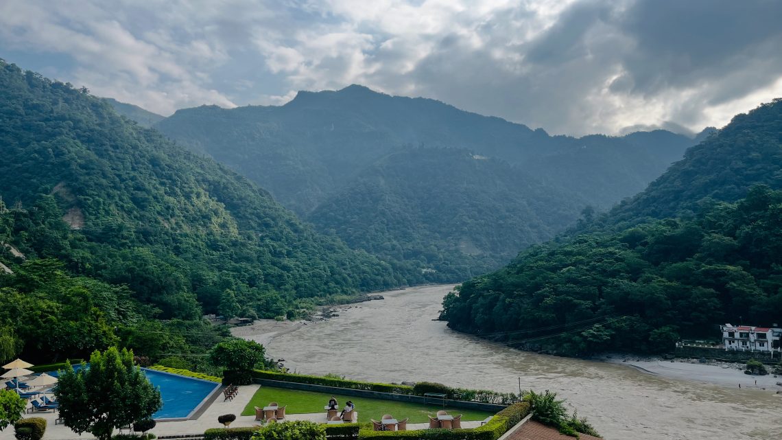 Laying down emotional weight by a calm mountain stream, finding peace and renewal in nature