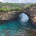 Cave bay in Vietnam with still water and rock walls opening into light, reflecting quiet isolation and depth.